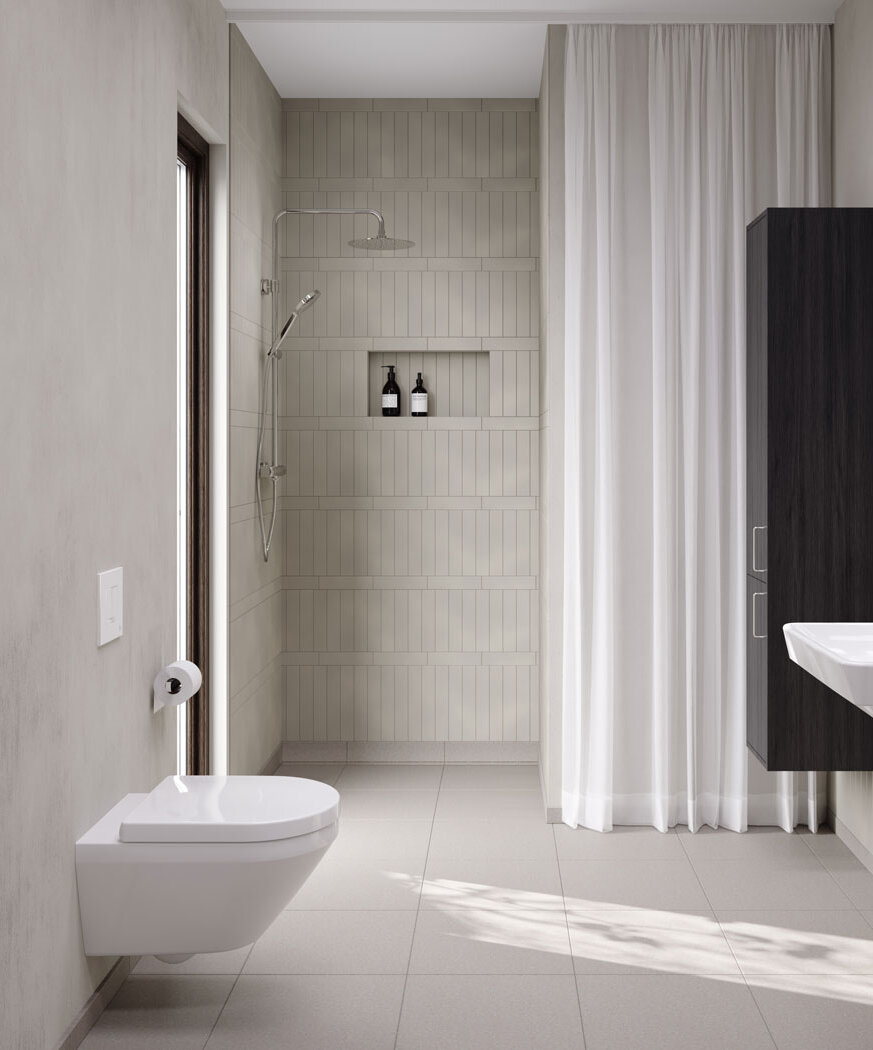 Vit vägghängd toalett i ett beige badrum.