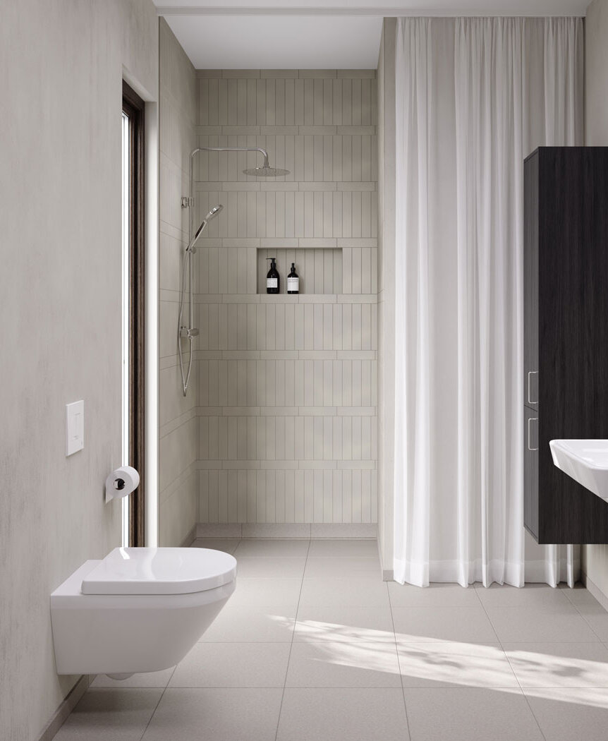 Valkoinen seinäasenteinen wc beigeässä kylpyhuoneessa