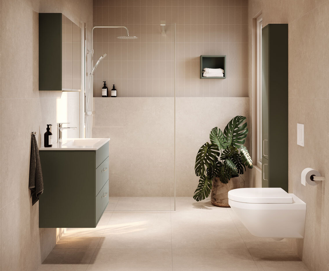 Minimalistiskt badrum med beige kakel, gröna skåp, duschkabin och en vägghängd toalett med Hygienic Twist spolning.