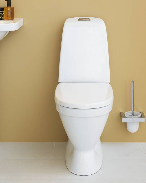 Toilet Nautic 1510 skjult P-lås, Hygienic Flush - Rengøringsvenligt og minimalistisk design 
Med åben skyllerand for nemmere rengøring 
Lav skylleknap i flot design