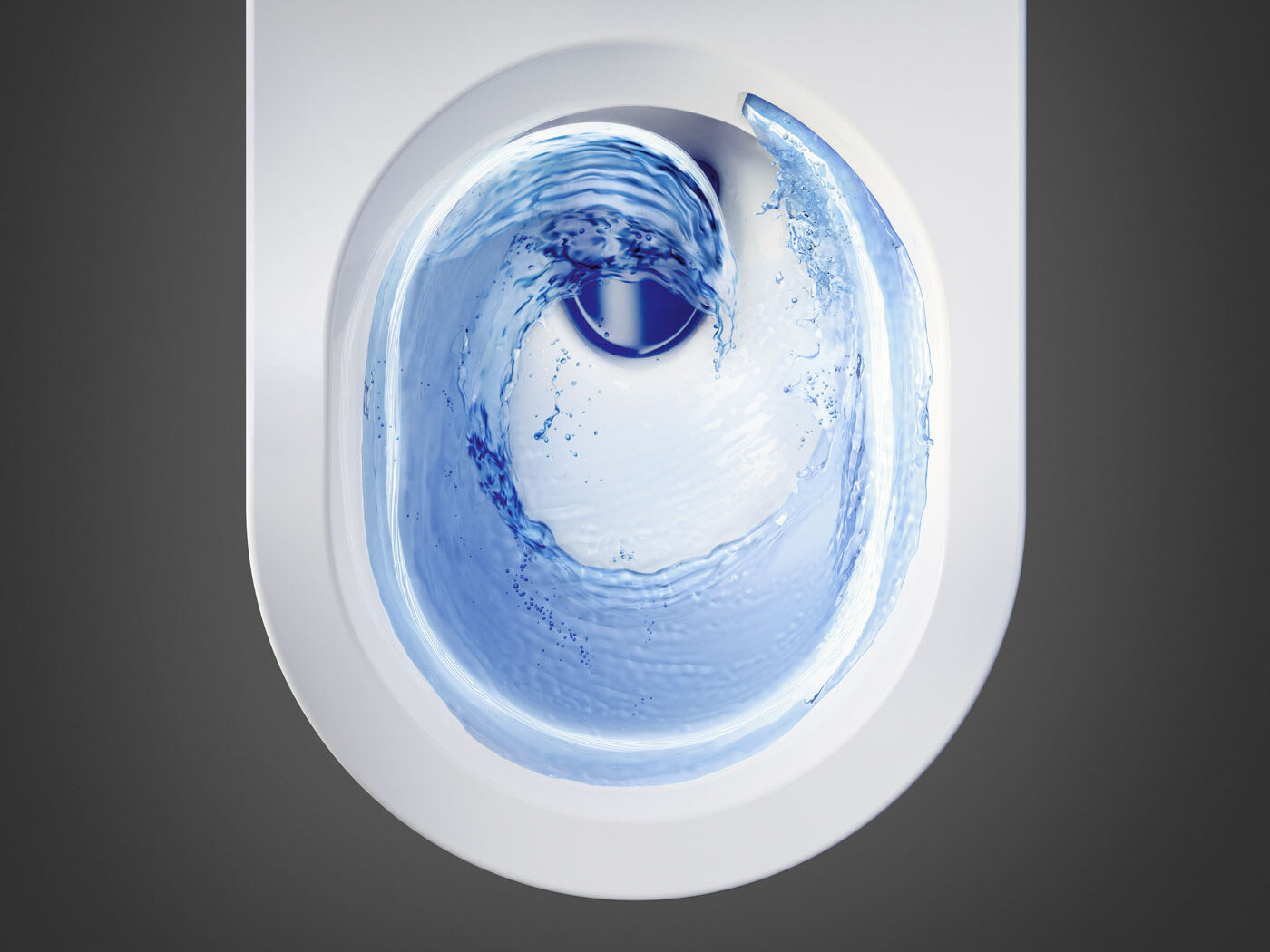 Toilet seat seen from above with flushing creating swirls in the water.