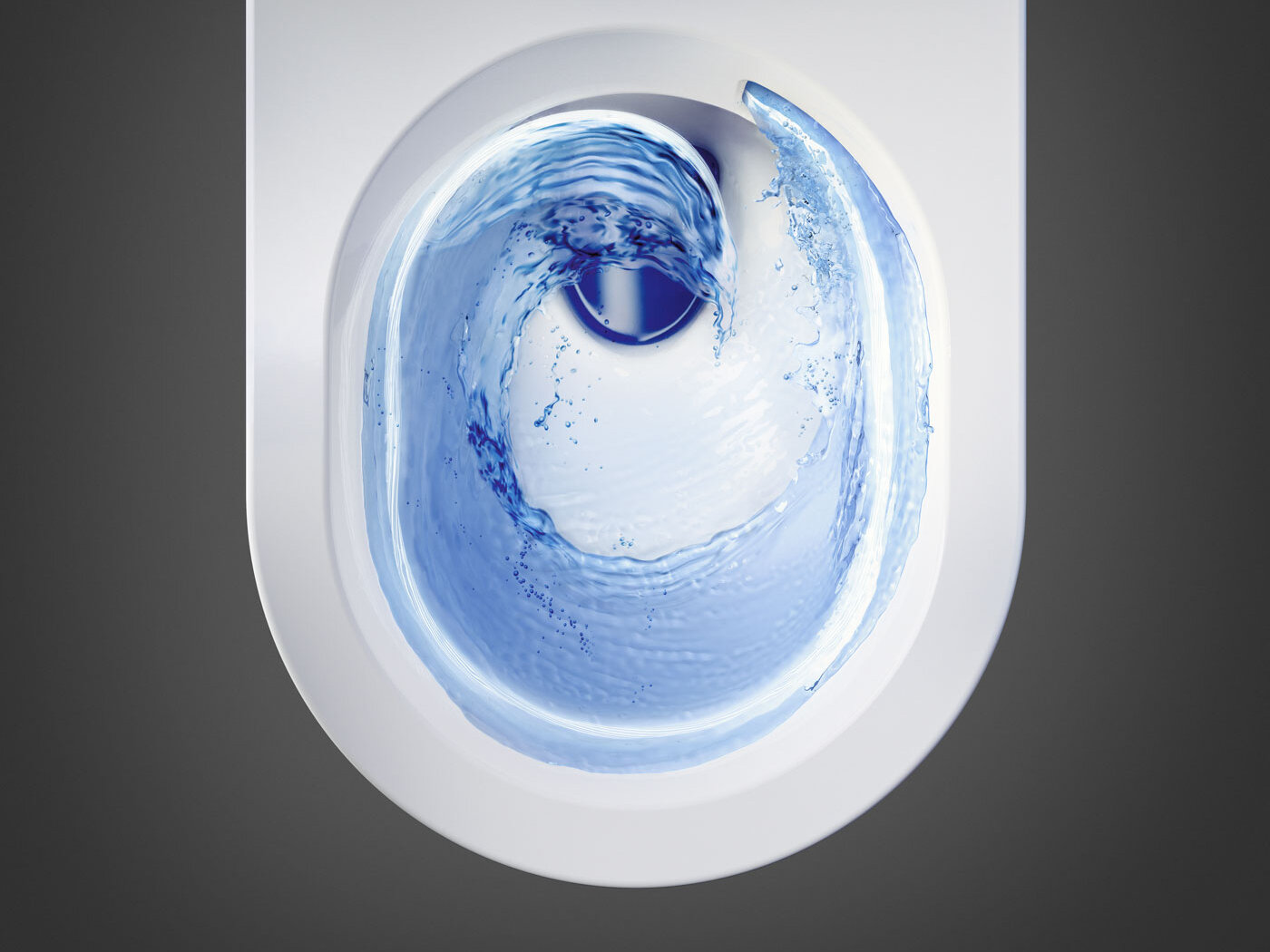 WC-istuin ylhäältä katsottuna, huuhtelu luo pyörteitä veteen.