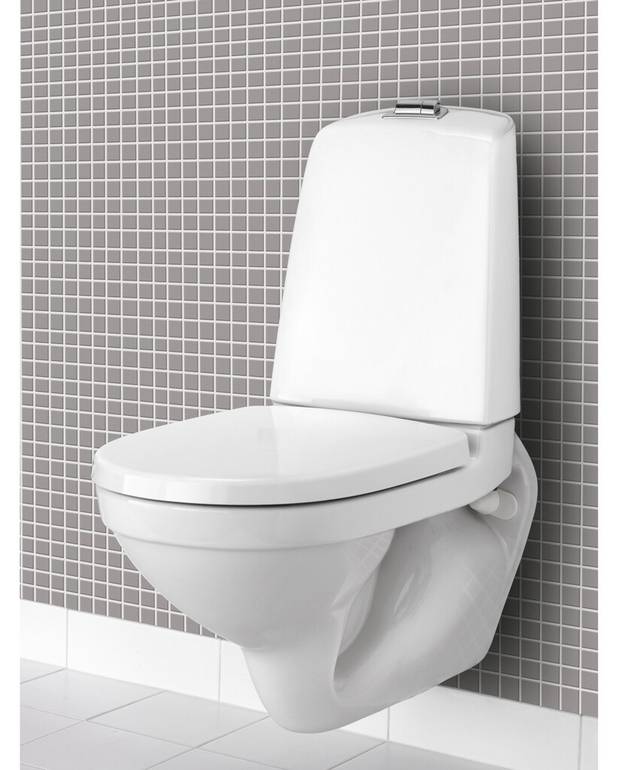Seinä-WC Nautic 1522 - huuhtelusäiliöllä, Hygienic Flush - Helposti puhdistettava ja minimalistinen muotoilu
Tilaa seinän ja säiliön välissä helpottamaan puhtaanapitoa
Avoimella huuhtelukauluksella helpottamaan puhtaanapitoa