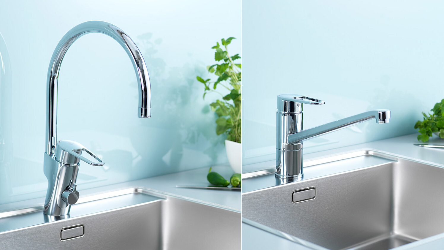 Two Gustavsberg stainless steel sinks with two chrome kitchen mixers, set against a light blue backsplash.