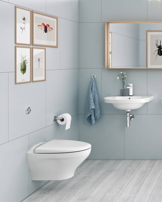 Håndvask Nautic 5556 - til bolt-/konsolmontering 56 cm - Rengøringsvenligt og minimalistisk design
Ellipseformet bassin og god afsætningsplads
Til montering med bolte eller konsol