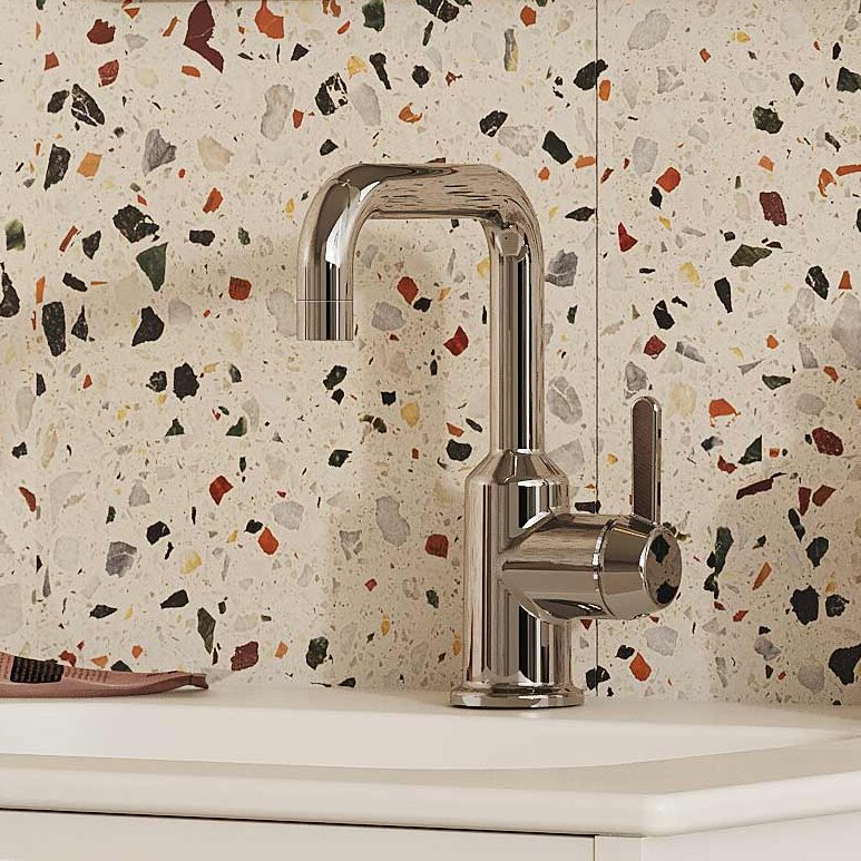 Wall-mounted Ducentic bathroom vanity in white with chrome washbasin mixer.
